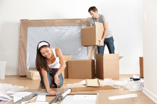 Removal van and moving team preparing a house move in Hanworth