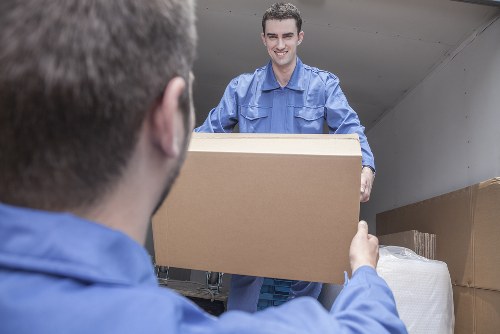 Removal team loading boxes for a home move in Hanworth