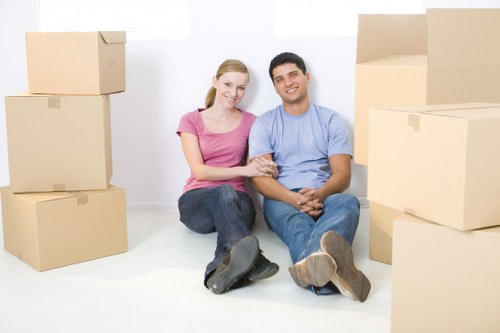 Furniture and boxes being loaded into a removals van