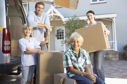 Commercial removals team transporting office furniture and equipment