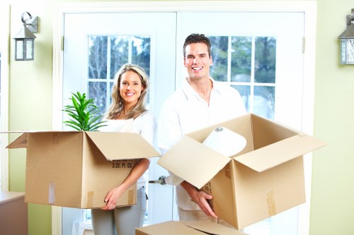 Team member assessing moving risks before lifting an item