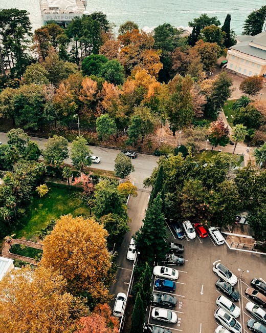 Close-up view of an outdoor parking space surface made of dark asphalt, featuring a faded white-painted number '22' marking. There are additional white parking lines neighbouring the numbered space, which is intended for vehicle parking related to house removals or relocation services. The image captures the surface with minor cracks and scattered small debris, indicative of an external environment typical for home moving logistics. This parking space could be used for loading or unloading furniture and boxes during a move managed by Man with Van Hanworth, aligning with guidance on parking, timing, and access for house removals at Hanworth. The overall scene emphasizes the importance of understanding parking arrangements in relocation planning, particularly for efficient furniture transport and packing and moving operations.